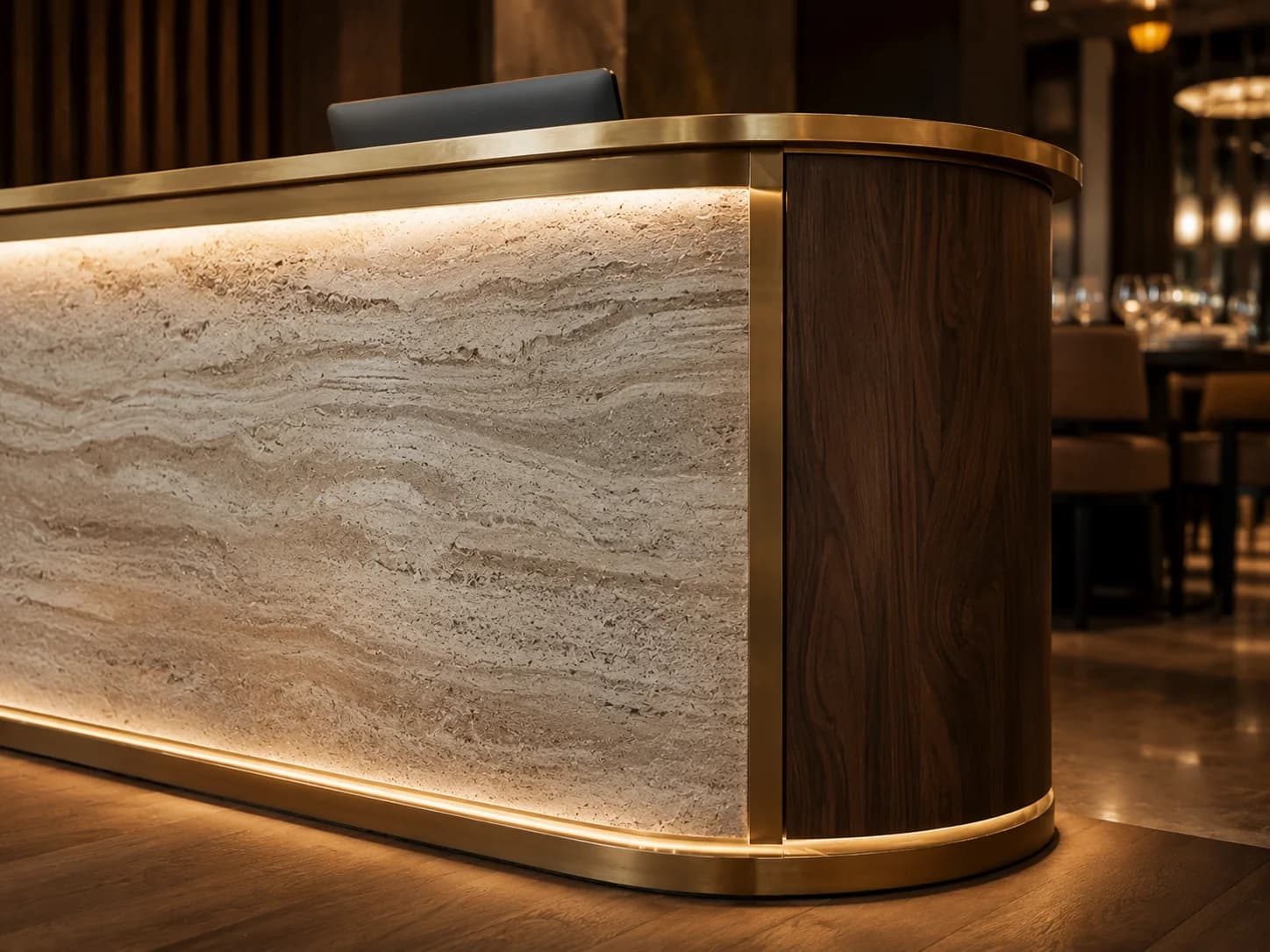 Custom Restaurant Reception Desk Dubai Close-up of bespoke restaurant reception desk with stone, walnut and brass detailing