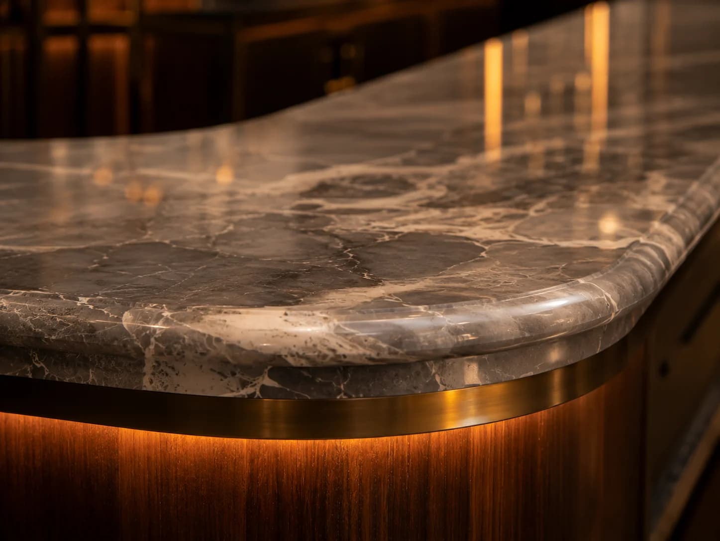 Luxury Marble Bar Detail Dubai Restaurant Close-up of luxury marble bar detailing with brass trim and integrated lighting