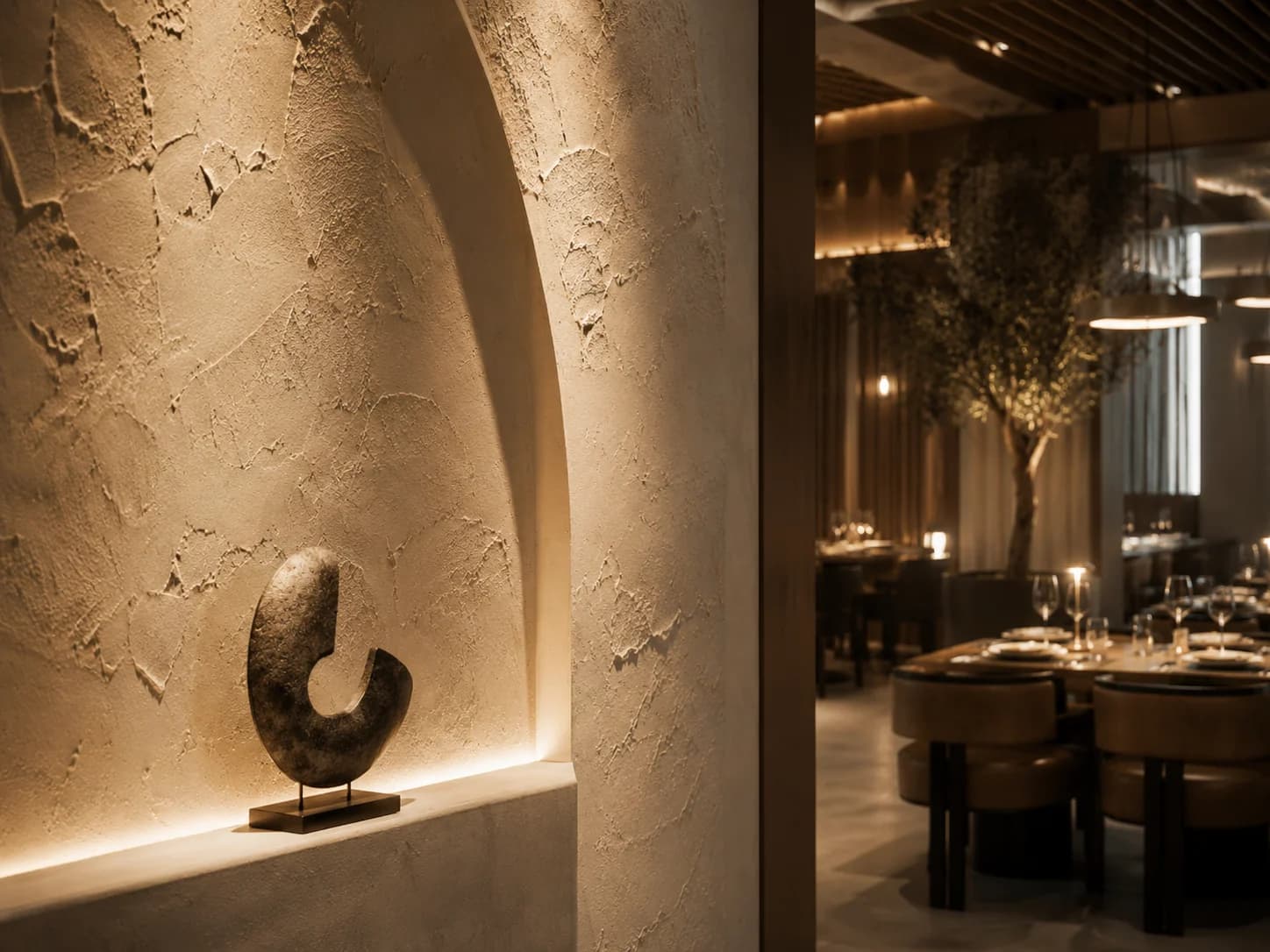 Luxury Restaurant Feature Wall Detail Dubai Close-up of textured restaurant feature wall with curved niche and concealed lighting