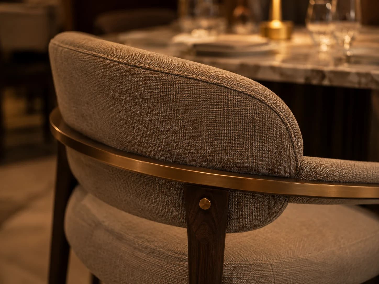 Luxury Restaurant Furniture Detail Dubai Close-up of premium restaurant chair upholstery and brass detailing